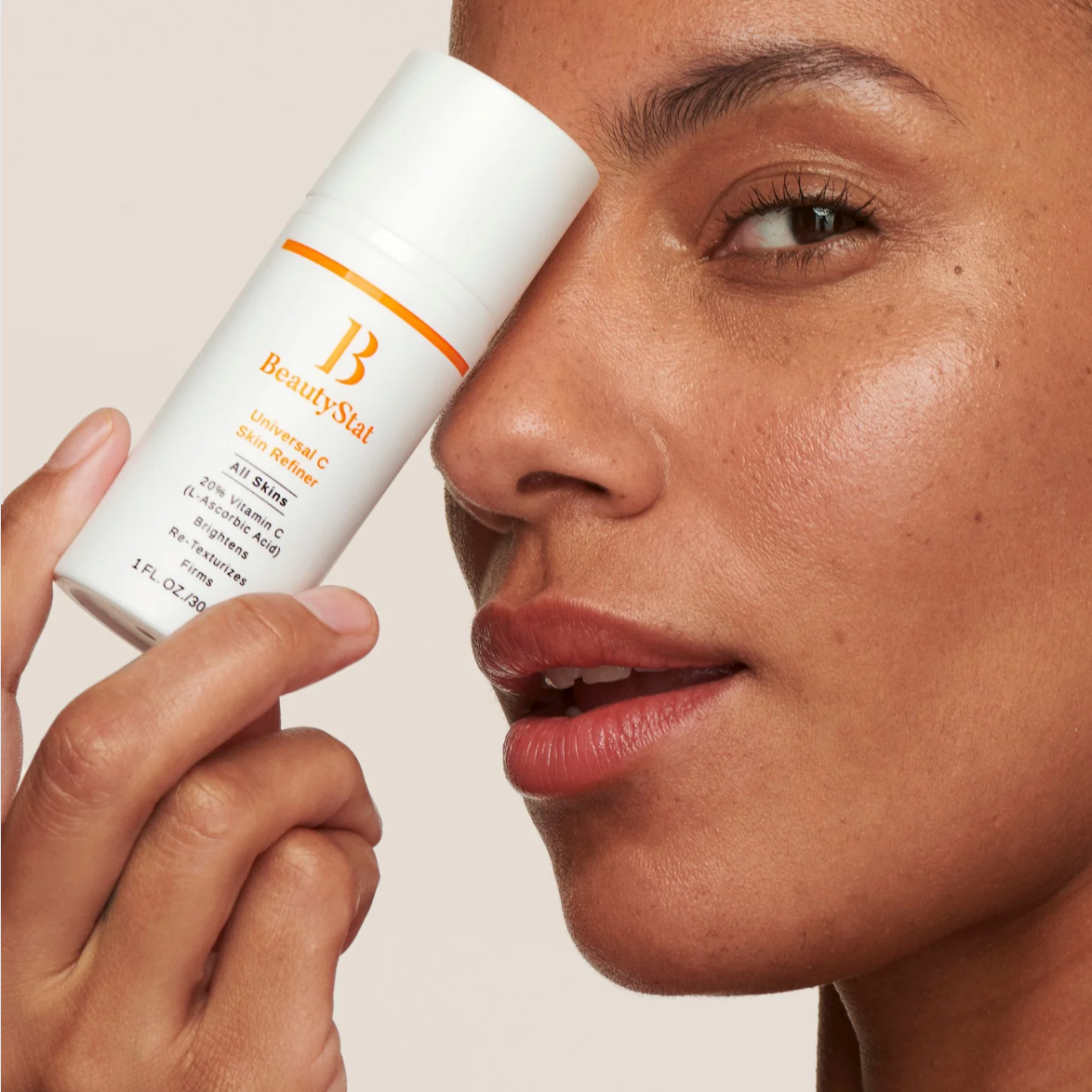 women holding beautystat universal skin refiner