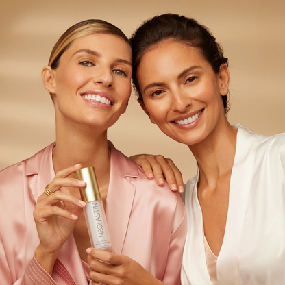 two women holding the triple peptide serum in hands